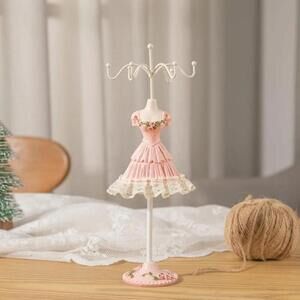 Rotating Jewelry Rack In Long Ruffled Dress